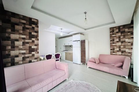 ÇİFTLİKKÖY'DE SİTE İÇİ YÜKSEK KAT GENİŞ BALKONLU EŞYALI 1+1