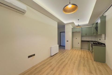 KARİZMA'DAN 75. YIDA DENİZ MANZARALI CAM BALKONLU ARA KAT 1+1
