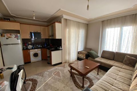 KARİZMA'DAN ÇİFTLİKKÖYDE EŞYALI HAVUZLU KİRACILI YATIRIMLIK 1+1