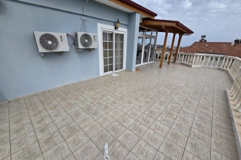 Kuyuluk'ta 2.500m² İmarlı Arsa İçinde Lüks Tripleks Villa