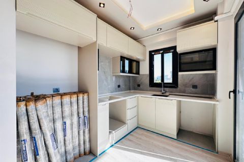 MEZİTLİ KUYULUK'TA 3 CEPHELİ DOĞALGAZLI MODERN 2+1